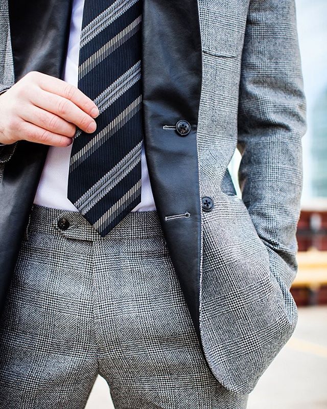 A grey tie matched with a grey suit